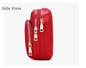 Side view of red multi-layer nylon crossbody bag with three gold zippers and fabric texture
