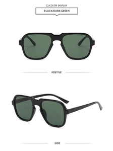 Detail view of large black frame sunglasses with dark green lenses in dual angle perspective
