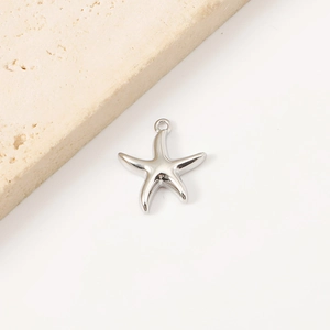 Polished silver starfish pendant accessory on a stone base for DIY ocean necklaces