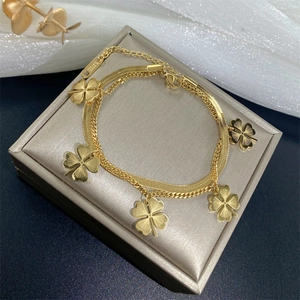 Double-layer gold stainless steel chain bracelet with five engraved clover charms
