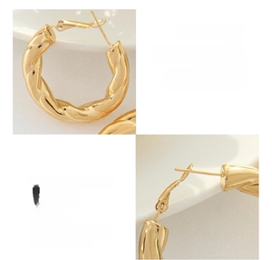 Close-up detail of 18k gold plated titanium steel hoop earrings with twisted rope texture