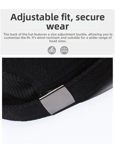 Detail of winter wool cap showing black knit fabric and adjustable grey metal buckle
