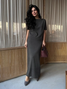 Elegant dark grey knit two-piece set featuring short sleeve top and long maxi skirt