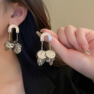 U-shaped silver needle earrings with heavy metal texture and hammered finish