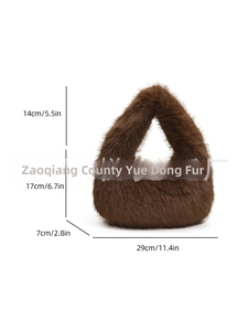 Brown faux fur handbag featuring a plush texture and minimalist triangular silhouette