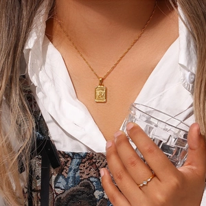 Gold plated butterfly angel pendant necklace and sparkling rhinestone ring on model