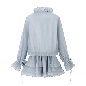 Rear view of light blue chiffon set featuring tiered ruffles and bell sleeves with ties