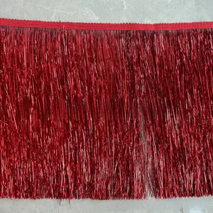 Close-up of 20CM metallic red fringe trim with woven header for festive garment decoration