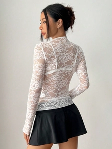 Slim-fit white lace long-sleeved top with high neck and back cutout detail