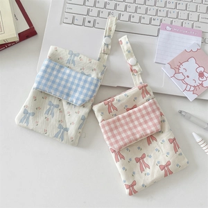 Floral nurse pocket protector and stationery organizer with blue and pink fabric patterns