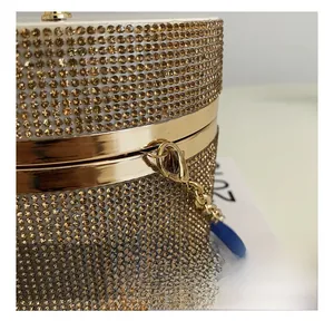 Macro shot of the luxury champagne rhinestone dinner bag with golden hardware and chain detail