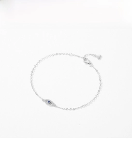 Macro detail of S925 sterling silver evil eye bracelet with lobster clasp and heart charm