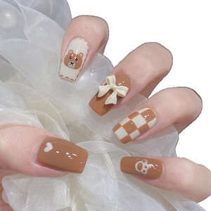 Cute brown press-on nails with cartoon bear, 3D bow and checkerboard patterns