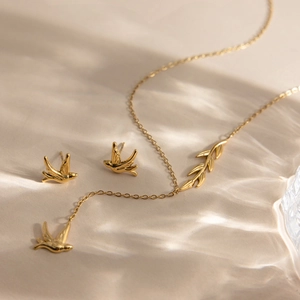Elegant 18K gold plated bird and willow leaf jewelry set with necklace and earrings