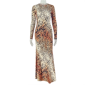 Close-up of leopard print texture and crew neck design on long sleeve slim fit dress