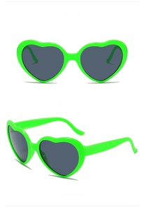 Front and side views of bright green heart-shaped sunglasses with dark lenses