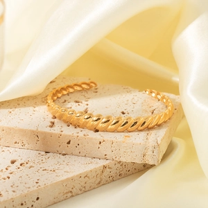Chic 18K gold plated stainless steel C-shape twisted cuff bracelet on stone base