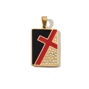 Detail of gold rectangular pendant featuring a red cross and sparkling white rhinestones