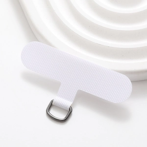 Macro shot of white reinforced fabric T-shaped phone lanyard tab with a metal D-ring