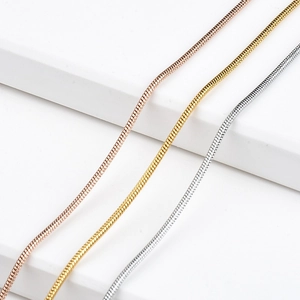 Three sleek snake bone chain necklaces in rose gold, gold and silver stainless steel