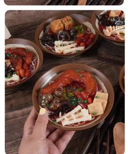 Realistic Luosifen snail noodle model with duck feet and bamboo shoots in a ceramic bowl