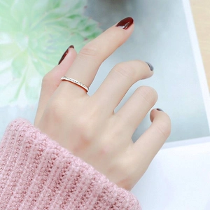 Detailed view of minimalist titanium steel eternity ring with a row of small crystals