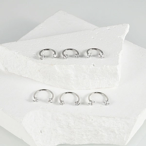 Set of six stainless steel horseshoe rings with clear cubic zirconia stones in 1.0mm size
