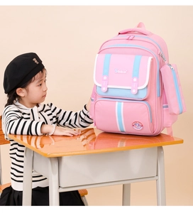 Pink ergonomic school bag for girls featuring side mesh pockets and matching pencil case