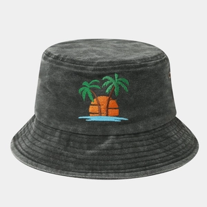 Close-up of coconut tree embroidery on a vintage washed grey cotton bucket hat