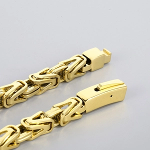 Macro shot of gold-plated stainless steel Byzantine chain highlighting its intricate weave