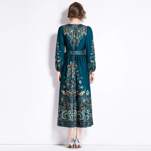 Back view of a long-sleeve V-neck paisley print dress with waist tie and full skirt