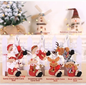 Detail of plush Santa and Snowman ornaments with size specs on a white fence background