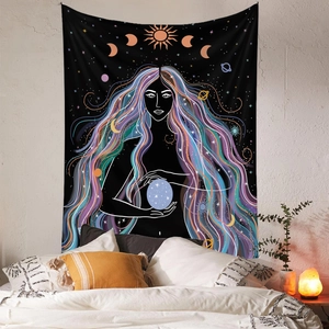 Detail of bohemian tapestry featuring mystery goddess and celestial sun moon patterns