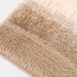 Detailed close-up of soft faux fur material showing gradient beige plush texture