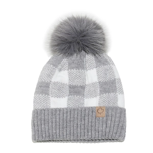 Detailed knit texture of grey plaid winter beanie with faux fur pom and maple leaf patch