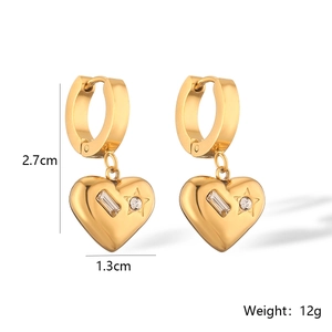 Detail view of gold heart earrings with zircon stones including size measurements