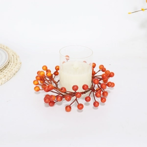 Orange berry candle ring wreath with glass holder and ivory pillar candle for Halloween decor