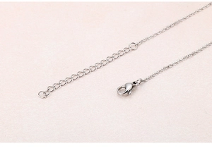 Detail of silver chain with lobster clasp and adjustable extension link closure