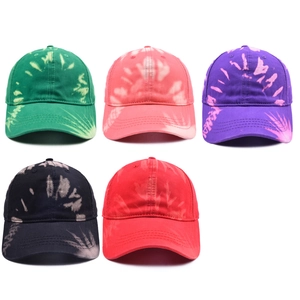 Five assorted tie-dye baseball caps in cotton canvas with vibrant graffiti patterns