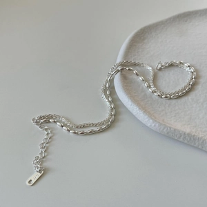 Close-up of S925 sterling silver cauliflower chain with teardrop hallmarked tag