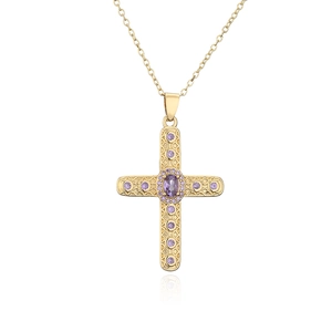 Close-up of 18K gold plated cross pendant with large oval and small purple zircons