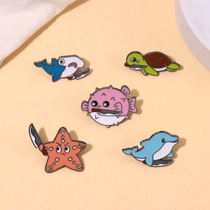 5-piece cartoon ocean animal enamel pins featuring a quirky shark and turtle with knives