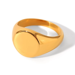 Detailed close-up of a minimalist golden stainless steel signet ring with a polished mirror finish