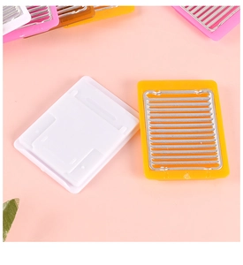 Detailed close-up of miniature dollhouse cooling racks in various bright candy colors