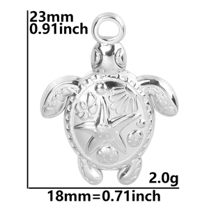 Macro view of silver sea turtle pendant showing detailed shell carvings and dimensions