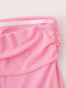 Detail of pink mesh dress featuring pleated fabric and anti-slip silicone interior strap