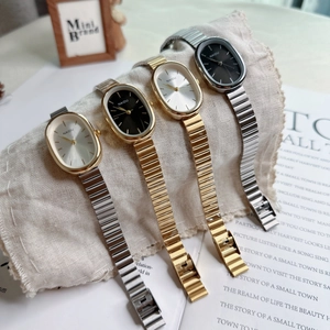 Elegant women's oval quartz watches with metal chain bands in gold and silver finishes
