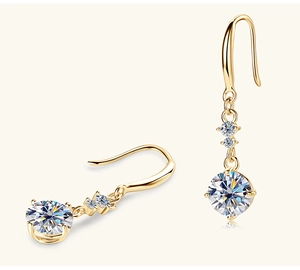 Macro detail of gold S925 sterling silver drop earrings with brilliant moissanite stones
