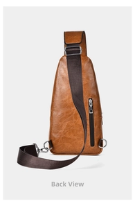 Detail view of the back of a vintage brown leather chest bag with a vertical zipper pocket