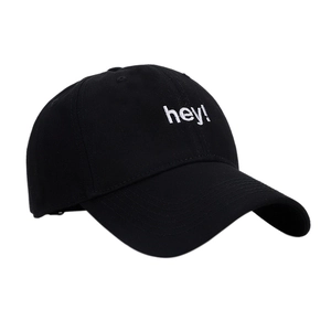 Black cotton baseball cap featuring white 'hey!' embroidery with a soft top and curved brim